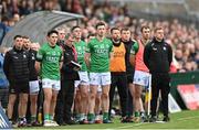 15 April 2023; Fermanagh manager Kieran Donnelly and his team during the playing of the National Anthem before the Ulster GAA Football Senior Championship Quarter-Final match between Fermanagh and Derry at Brewster Park in Enniskillen, Fermanagh. Photo by Ramsey Cardy/Sportsfile