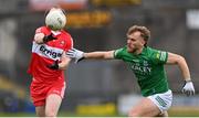 15 April 2023; Padraig Cassidy of Derry in action against Ultan Kelm of Fermanagh during the Ulster GAA Football Senior Championship Quarter-Final match between Fermanagh and Derry at Brewster Park in Enniskillen, Fermanagh. Photo by Ramsey Cardy/Sportsfile