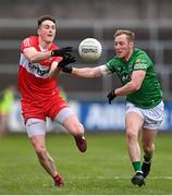 15 April 2023; Gareth McKinless of Derry in action against Cian McManus of Fermanagh during the Ulster GAA Football Senior Championship Quarter-Final match between Fermanagh and Derry at Brewster Park in Enniskillen, Fermanagh. Photo by Ramsey Cardy/Sportsfile