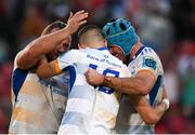 15 April 2023; Sam Prendergast of Leinster is embraced by teammates Ed Byrne and Will Connors after kicking a penalty to win the United Rugby Championship match between Emirates Lions and Leinster at Emirates Airlines Park in Johannesburg, South Africa. Photo by Harry Murphy/Sportsfile