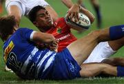 15 April 2023; Malakai Fekitoa of Munster is tackled by Dan du Plessis of DHL Stormers during the United Rugby Championship match between DHL Stormers and Munster at DHL Stadium in Cape Town, South Africa. Photo by Carl Fourie/Sportsfile