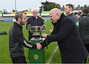 15 April 2023; St Joseph's manager Stephen Foy is presented with his winner's medal by FAI President Gerry McAnaney after the FAI Youth Cup Final match between St Joseph’s AFC, Dublin, and College Corinthians AFC, Cork, at the Carlisle Grounds in Bray, Wicklow. Photo by Seb Daly/Sportsfile