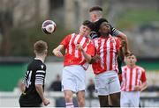 15 April 2023; Callum Byrne, left, and Emmanual Ogunsaikon of St Joseph’s in action against Eric Cunningham of College Corinthians during the FAI Youth Cup Final match between St Joseph’s AFC, Dublin, and College Corinthians AFC, Cork, at the Carlisle Grounds in Bray, Wicklow. Photo by Seb Daly/Sportsfile