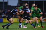 15 April 2023; Bundee Aki of Connacht is tackled by Rhys Priestland of Cardiff, left, and Max Llewellyn during the United Rugby Championship match between Connacht and Cardiff at Sportsground in Galway. Photo by Tyler Miller/Sportsfile