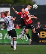 16 April 2023; Jordan McEneff of Derry City in action against Greg Sloggett, left, and Darragh Leahy of Dundalk during the SSE Airtricity Men's Premier Division match between Dundalk and Derry City at Oriel Park in Dundalk, Louth. Photo by Ben McShane/Sportsfile