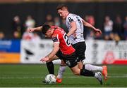 16 April 2023; Adam O'Reilly of Derry City in action against John Martin of Dundalk during the SSE Airtricity Men's Premier Division match between Dundalk and Derry City at Oriel Park in Dundalk, Louth. Photo by Ben McShane/Sportsfile