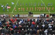 16 April 2023; The Tyrone and Monaghan teams parade behind the Mayobridge band before the Ulster GAA Football Senior Championship Quarter-Final match between Tyrone and Monaghan at O'Neill's Healy Park in Omagh, Tyrone. Photo by Ramsey Cardy/Sportsfile