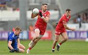 16 April 2023; Matthew Donnelly of Tyrone evades the tackle of Kieran Duffy of Monaghan during the Ulster GAA Football Senior Championship Quarter-Final match between Tyrone and Monaghan at O'Neill's Healy Park in Omagh, Tyrone. Photo by Ramsey Cardy/Sportsfile