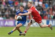 16 April 2023; Ryan Wylie of Monaghan is tackled by Frank Burns of Tyrone during the Ulster GAA Football Senior Championship Quarter-Final match between Tyrone and Monaghan at O'Neill's Healy Park in Omagh, Tyrone. Photo by Ramsey Cardy/Sportsfile
