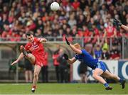 16 April 2023; Darragh Canavan of Tyrone kicks a point under pressure from Ryan O'Toole of Monaghan during the Ulster GAA Football Senior Championship Quarter-Final match between Tyrone and Monaghan at O'Neill's Healy Park in Omagh, Tyrone. Photo by Ramsey Cardy/Sportsfile