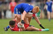 16 April 2023; Michael McKernan of Tyrone is tackled by Ryan O'Toole of Monaghan during the Ulster GAA Football Senior Championship Quarter-Final match between Tyrone and Monaghan at O'Neill's Healy Park in Omagh, Tyrone. Photo by Ramsey Cardy/Sportsfile