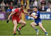 16 April 2023; Karl O Connell of Monaghan in action against Brian Kennedy of Tyrone during the Ulster GAA Football Senior Championship Quarter-Final match between Tyrone and Monaghan at O'Neill's Healy Park in Omagh, Tyrone. Photo by Sam Barnes/Sportsfile