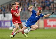16 April 2023; Conor McCarthy of Monaghan in action against Kieran McGeary of Tyrone during the Ulster GAA Football Senior Championship Quarter-Final match between Tyrone and Monaghan at O'Neill's Healy Park in Omagh, Tyrone. Photo by Ramsey Cardy/Sportsfile
