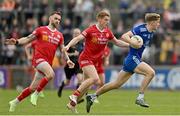 16 April 2023; Karl Gallagher of Monaghan in action against Ronan McNamee, left, and Peter Harte of Tyrone during the Ulster GAA Football Senior Championship Quarter-Final match between Tyrone and Monaghan at O'Neill's Healy Park in Omagh, Tyrone. Photo by Ramsey Cardy/Sportsfile