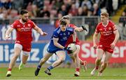 16 April 2023; Stephen O’Hanlon of Monaghan in action against Pádraig Hampsey, left, Matthew Donnelly, centre, and Peter Harte of Tyrone during the Ulster GAA Football Senior Championship Quarter-Final match between Tyrone and Monaghan at O'Neill's Healy Park in Omagh, Tyrone. Photo by Ramsey Cardy/Sportsfile