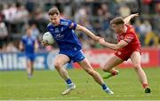 16 April 2023; Karl O'Connell of Monaghan in action against Cormac Quinn of Tyrone during the Ulster GAA Football Senior Championship Quarter-Final match between Tyrone and Monaghan at O'Neill's Healy Park in Omagh, Tyrone. Photo by Ramsey Cardy/Sportsfile