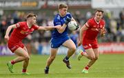 16 April 2023; Michael Bannigan of Monaghan in action against Cormac Quinn, left, and Kieran McGeary of Tyrone during the Ulster GAA Football Senior Championship Quarter-Final match between Tyrone and Monaghan at O'Neill's Healy Park in Omagh, Tyrone. Photo by Ramsey Cardy/Sportsfile