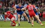 16 April 2023; Conor McCarthy of Monaghan is tackled by Ronan McNamee of Tyrone during the Ulster GAA Football Senior Championship Quarter-Final match between Tyrone and Monaghan at O'Neill's Healy Park in Omagh, Tyrone. Photo by Ramsey Cardy/Sportsfile