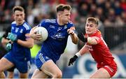 16 April 2023; Karl O'Connell of Monaghan in action against Ruairi Canavan of Tyrone during the Ulster GAA Football Senior Championship Quarter-Final match between Tyrone and Monaghan at O'Neill's Healy Park in Omagh, Tyrone. Photo by Ramsey Cardy/Sportsfile