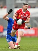 16 April 2023; Matthew Donnelly of Tyrone evades the tackle of Kieran Duffy of Monaghan during the Ulster GAA Football Senior Championship Quarter-Final match between Tyrone and Monaghan at O'Neill's Healy Park in Omagh, Tyrone. Photo by Ramsey Cardy/Sportsfile