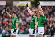 15 April 2023; Fermanagh players, from left, Shane McGullion, Brandon Horan and Shea Cullen defend a free during the Ulster GAA Football Senior Championship Quarter-Final match between Fermanagh and Derry at Brewster Park in Enniskillen, Fermanagh. Photo by Ramsey Cardy/Sportsfile