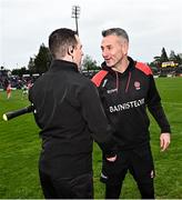 15 April 2023; Derry manager Rory Gallagher, right, shakes hands with linesman Niall McKenna after the Ulster GAA Football Senior Championship Quarter-Final match between Fermanagh and Derry at Brewster Park in Enniskillen, Fermanagh. Photo by Ramsey Cardy/Sportsfile