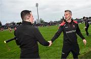 15 April 2023; Derry manager Rory Gallagher, right, shakes hands with linesman Niall McKenna after the Ulster GAA Football Senior Championship Quarter-Final match between Fermanagh and Derry at Brewster Park in Enniskillen, Fermanagh. Photo by Ramsey Cardy/Sportsfile