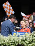 15 April 2023; Kelly Mallon of Armagh receives the cup from Uachtarán Cumann Peil Gael na mBan, Mícheál Naughton after her side's victory in the Lidl Ladies Football National League Division 2 Final match between Armagh and Laois at Croke Park in Dublin. Photo by Sam Barnes/Sportsfile