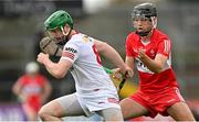 16 April 2023; Chris Kearns of Tyrone in action against James Friel of Derry during the Christy Ring Cup Round One match between Tyrone and Derry at O'Neill's Healy Park in Omagh, Tyrone. Photo by Ramsey Cardy/Sportsfile