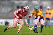 19 April 2023; Patrick Crotty of Clare in action against Timmy Wilk of Cork during the oneills.com Munster GAA Hurling U20 Championship Round 4 match between Clare and Cork at Cusack Park in Ennis, Clare. Photo by John Sheridan/Sportsfile