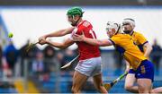 19 April 2023; Ben Cunningham of Cork scores his side's first goal despite the efforts of Oisín Clune of Clare during the oneills.com Munster GAA Hurling U20 Championship Round 4 match between Clare and Cork at Cusack Park in Ennis, Clare. Photo by John Sheridan/Sportsfile