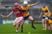 19 April 2023; Tadhg O’Connell of Cork in action against Ja Collins of Clare during the oneills.com Munster GAA Hurling U20 Championship Round 4 match between Clare and Cork at Cusack Park in Ennis, Clare. Photo by John Sheridan/Sportsfile