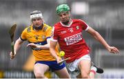 19 April 2023; Ben Cunningham of Cork in action against Ian MacNamara of Clare during the oneills.com Munster GAA Hurling U20 Championship Round 4 match between Clare and Cork at Cusack Park in Ennis, Clare. Photo by John Sheridan/Sportsfile