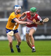 19 April 2023; Ben Cunningham of Cork in action against Oran Cahill of Clare during the oneills.com Munster GAA Hurling U20 Championship Round 4 match between Clare and Cork at Cusack Park in Ennis, Clare. Photo by John Sheridan/Sportsfile