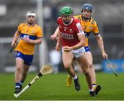 19 April 2023; Ben Cunningham of Cork in action against Jack O'Neill of Clare during the oneills.com Munster GAA Hurling U20 Championship Round 4 match between Clare and Cork at Cusack Park in Ennis, Clare. Photo by John Sheridan/Sportsfile