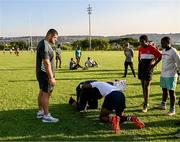 20 April 2023; Leinster Rugby players, together with Emirates Lions Community Rugby Officers, delivered a coaching clinic to the under-16 and under-19 teams, pictured is Leinster Rugby player Vakhtang Abdaladze with students at Allen Glen High School in Johannesburg, South Africa. Photo by Harry Murphy/Sportsfile