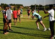 20 April 2023; Leinster Rugby players, together with Emirates Lions Community Rugby Officers, delivered a coaching clinic to the under-16 and under-19 teams, pictured is Leinster Rugby player Ben Brownlee with students at Allen Glen High School in Johannesburg, South Africa. Photo by Harry Murphy/Sportsfile