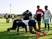 20 April 2023; Leinster Rugby players, together with Emirates Lions Community Rugby Officers, delivered a coaching clinic to the under-16 and under-19 teams, pictured is Leinster Rugby player Vakhtang Abdaladze with students at Allen Glen High School in Johannesburg, South Africa. Photo by Harry Murphy/Sportsfile