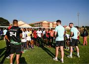20 April 2023; Leinster Rugby players, together with Emirates Lions Community Rugby Officers, delivered a coaching clinic to the under-16 and under-19 teams, pictured is Leinster Rugby player Ben Brownlee and Nick McCarthy with students at Allen Glen High School in Johannesburg, South Africa. Photo by Harry Murphy/Sportsfile