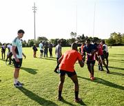 20 April 2023; Leinster Rugby players, together with Emirates Lions Community Rugby Officers, delivered a coaching clinic to the under-16 and under-19 teams, pictured is Leinster Rugby player Brian Deeny with students at Allen Glen High School in Johannesburg, South Africa. Photo by Harry Murphy/Sportsfile