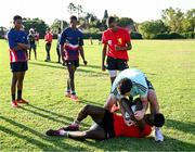 20 April 2023; Leinster Rugby players, together with Emirates Lions Community Rugby Officers, delivered a coaching clinic to the under-16 and under-19 teams, pictured is Leinster Rugby player Will Connors with students at Allen Glen High School in Johannesburg, South Africa. Photo by Harry Murphy/Sportsfile