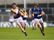 9 April 2023; Niall Hughes of Wexford in action against Kieran Lillis of Laois during the Leinster GAA Football Senior Championship Round 1 match between Laois and Wexford at Laois Hire O'Moore Park in Portlaoise, Laois. Photo by Tom Beary/Sportsfile