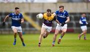 9 April 2023; Sean Nolan of Wexford in action against Mark Timmons of Laois during the Leinster GAA Football Senior Championship Round 1 match between Laois and Wexford at Laois Hire O'Moore Park in Portlaoise, Laois. Photo by Tom Beary/Sportsfile