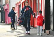 21 April 2023; Jamie Lennon of St Patrick's Athletic is greeted by a young supporter as he arrives before the SSE Airtricity Men's Premier Division match between St Patrick's Athletic and Shamrock Rovers at Richmond Park in Dublin. Photo by Seb Daly/Sportsfile