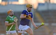 21 April 2023; James Morris of Tipperary in action against Adam English of Limerick during the oneills.com Munster GAA Hurling U20 Championship Round 4 match between Tipperary and Limerick at FBD Semple Stadium in Thurles, Tipperary. Photo by Stephen Marken/Sportsfile