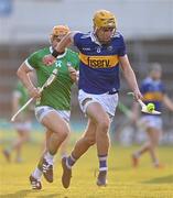 21 April 2023; James Morris of Tipperary in action against Adam English of Limerick during the oneills.com Munster GAA Hurling U20 Championship Round 4 match between Tipperary and Limerick at FBD Semple Stadium in Thurles, Tipperary. Photo by Stephen Marken/Sportsfile