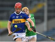21 April 2023; Jack Leamy of Tipperary in action against Adam English of Limerick during the oneills.com Munster GAA Hurling U20 Championship Round 4 match between Tipperary and Limerick at FBD Semple Stadium in Thurles, Tipperary. Photo by Stephen Marken/Sportsfile