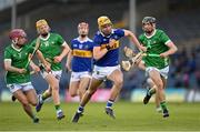 21 April 2023; James Morris of Tipperary in action against Limerick players from left, John Kirby, Fintan Fitzgerald, and Barry Duff during the oneills.com Munster GAA Hurling U20 Championship Round 4 match between Tipperary and Limerick at FBD Semple Stadium in Thurles, Tipperary. Photo by Stephen Marken/Sportsfile