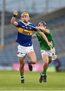 21 April 2023; James Morris of Tipperary in action against Barry Duff of Limerick during the oneills.com Munster GAA Hurling U20 Championship Round 4 match between Tipperary and Limerick at FBD Semple Stadium in Thurles, Tipperary. Photo by Stephen Marken/Sportsfile
