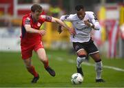 21 April 2023; Rayhan Tullock of Dundalk in action against Andrew Quinn of Shelbourne during the SSE Airtricity Men's Premier Division match between Shelbourne and Dundalk at Tolka Park in Dublin. Photo by David Fitzgerald/Sportsfile